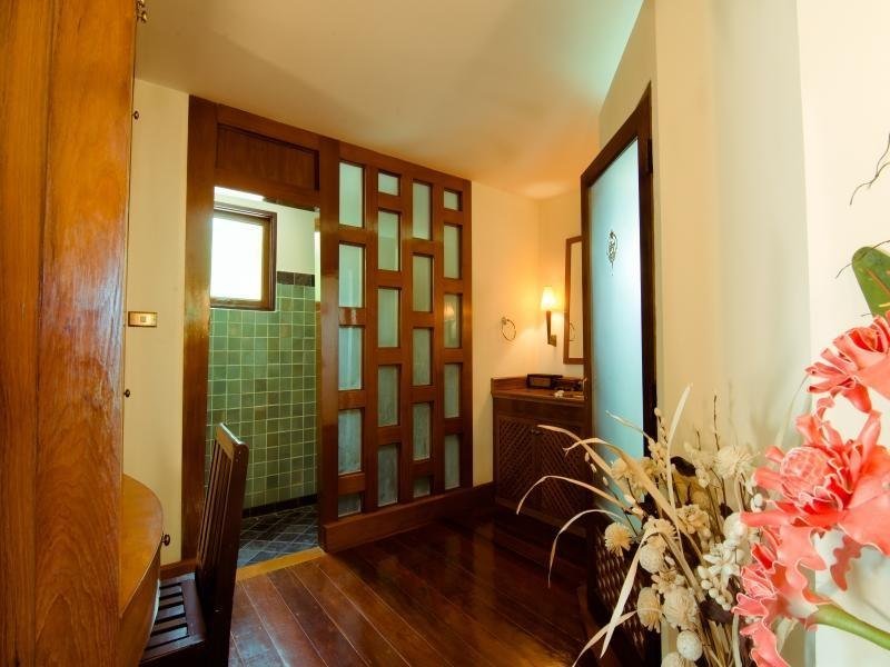 Villa entrance and seating at Baan Thai Lanta Resort