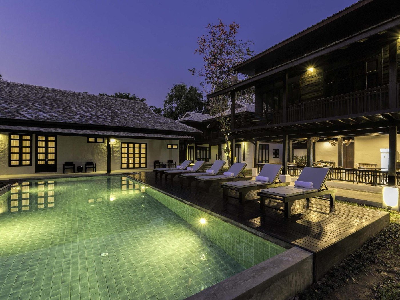 Central outdoor pool at Chotana Villa at dusk