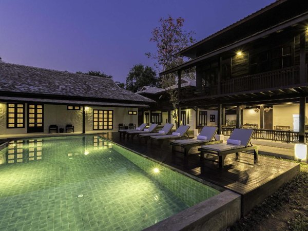 Central outdoor pool at Chotana Villa at dusk
