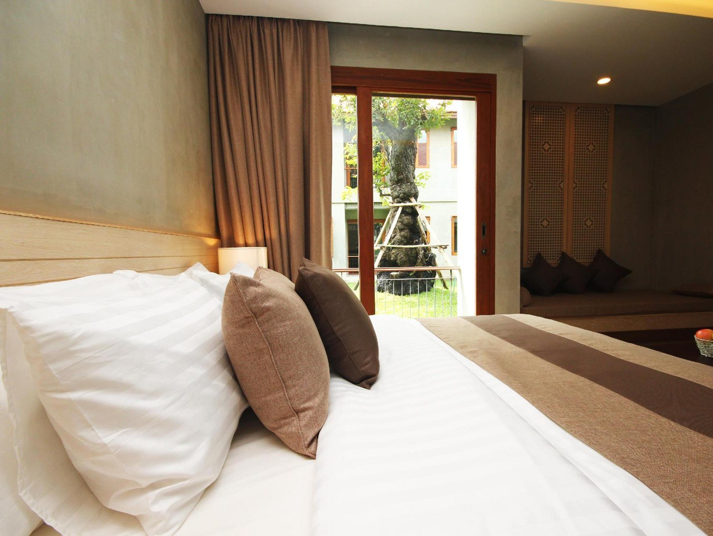 Bedroom and terrace doorway at CHU Hotel Chiangmai