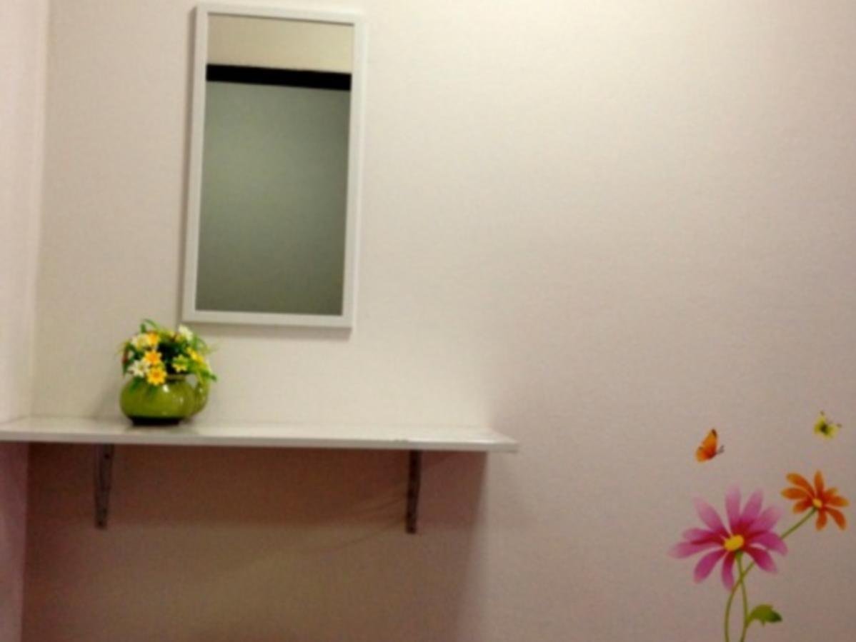 Desk and mirror inside Friend Hostel