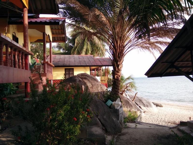 Shoreline buildings and palm at Golden Beach Resort Koh Phangan