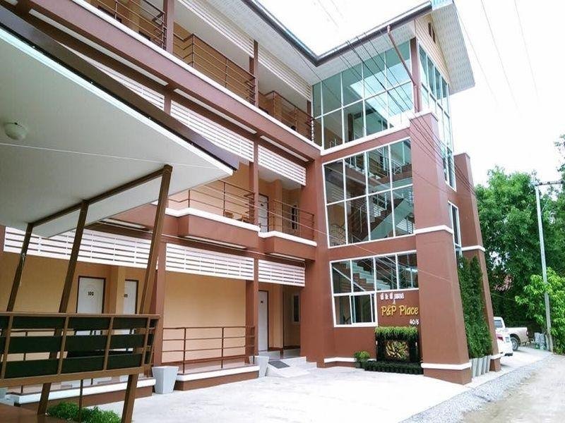 Open corridors and glazed stairwell at P&P Place in Kanchanaburi