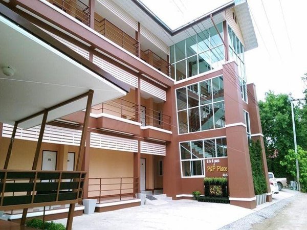 Open corridors and glazed stairwell at P&P Place in Kanchanaburi