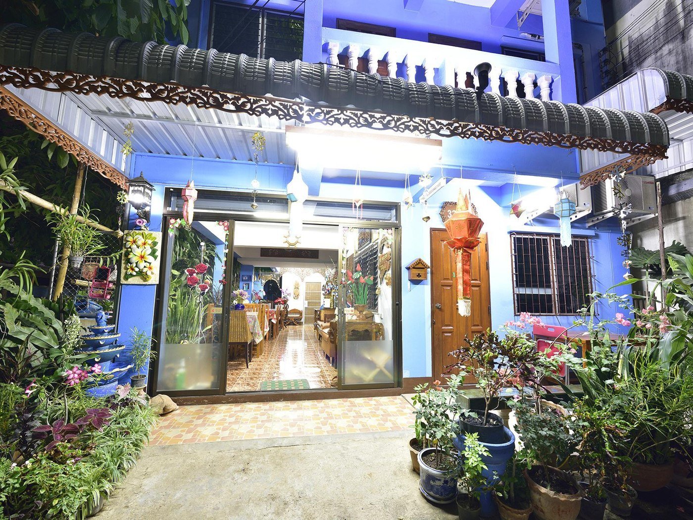 Saithong House exterior illuminated at night