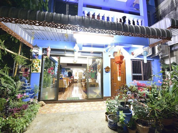 Saithong House exterior illuminated at night